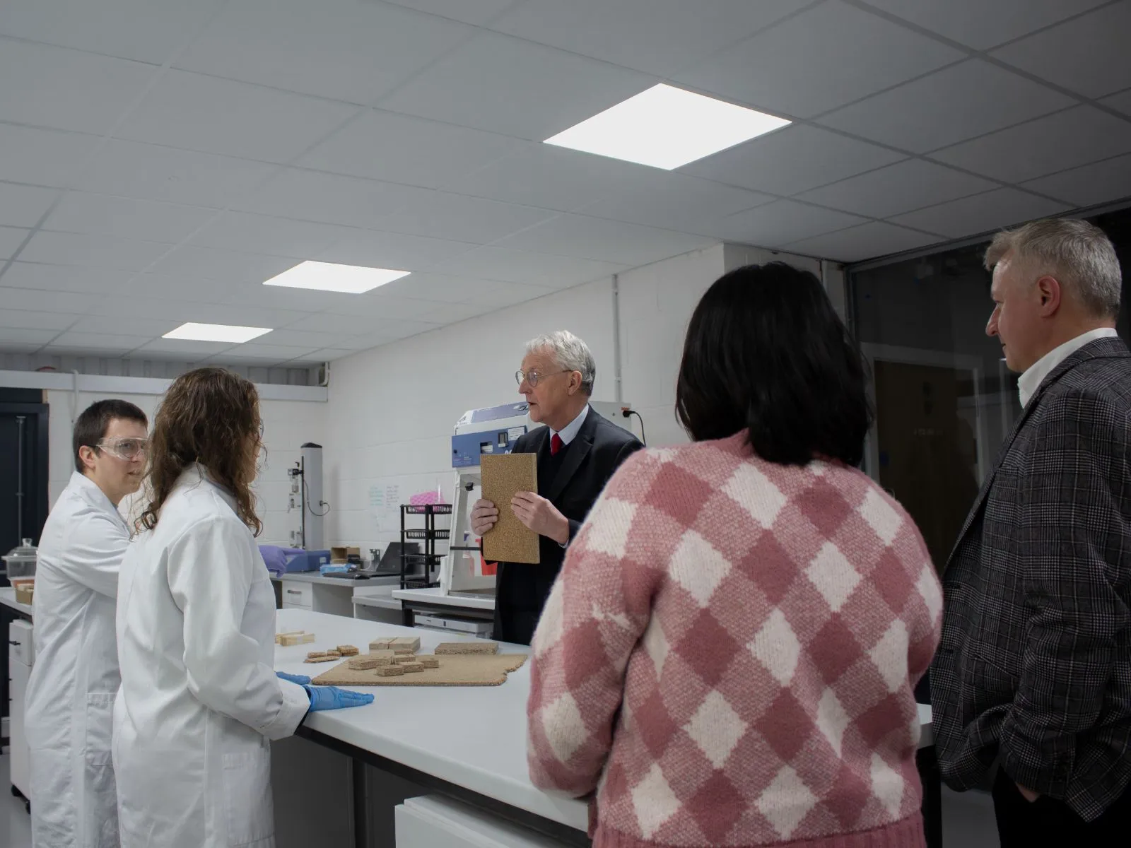 Hilary Benn MP talks with the BindEthics team in the Quick Labs facility