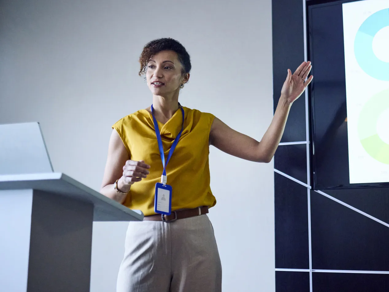 a woman standing at a podium