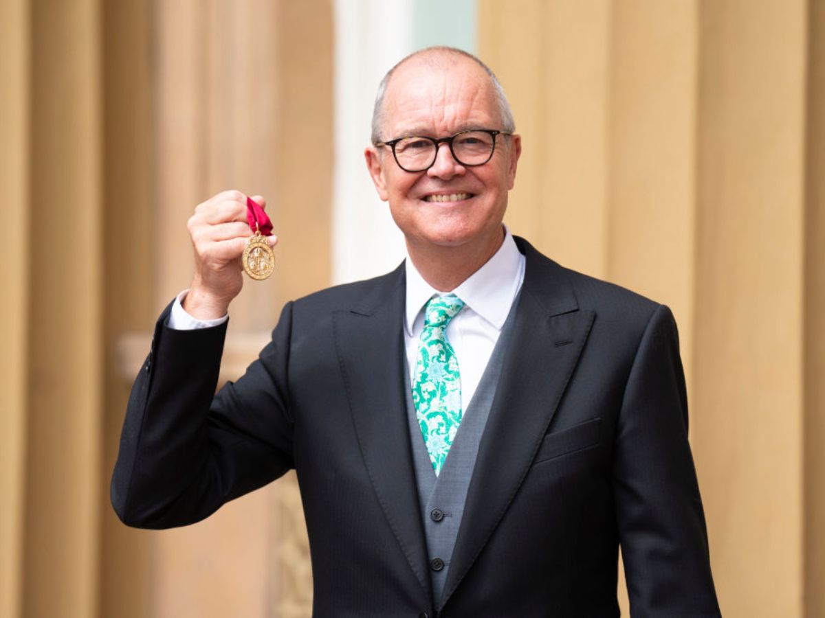 Patrick Vallance showing knighthood medal