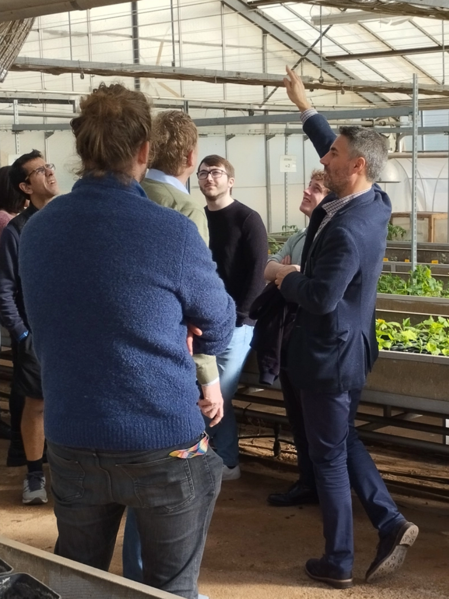 The BoostCrop team giving a tour in a green house