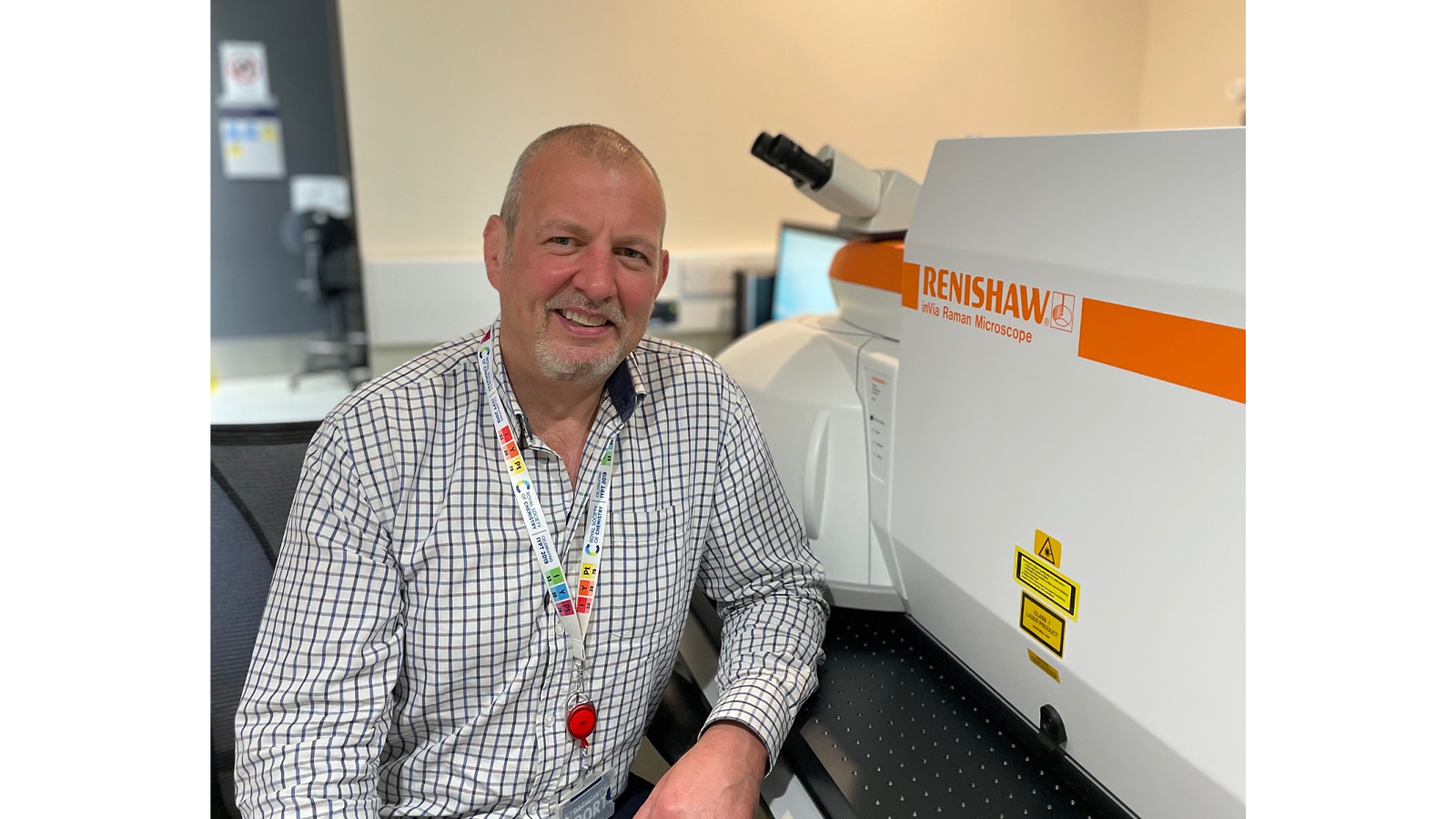 Professor Duncan Graham next to machinery in his lab