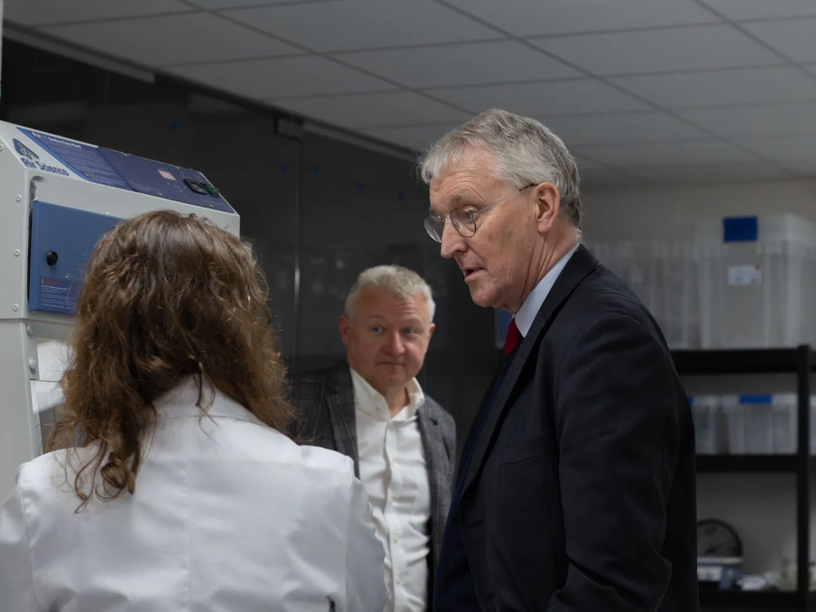 Hilary Benn MP (right) talks to a member of the BindEthics team while Andrew Waterworth stands in the background
