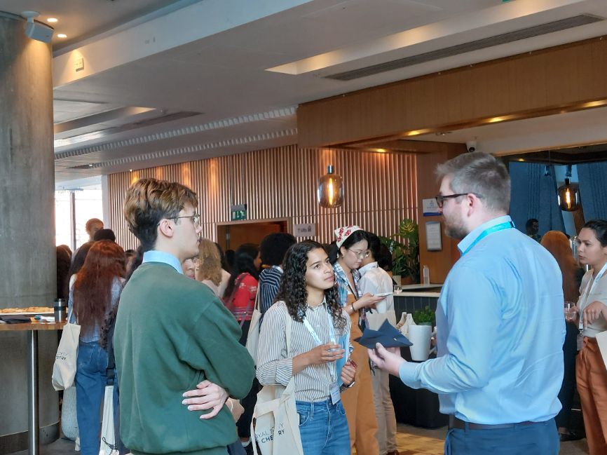 Mike Kenny, of AM Technology, talks with members of the new cohort
