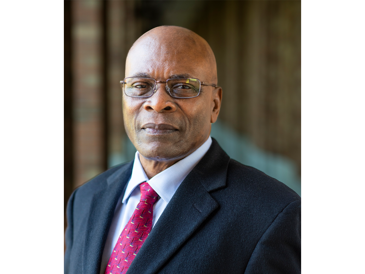 Professor Samson Jenekhe in a suit and tie and wearing glasses