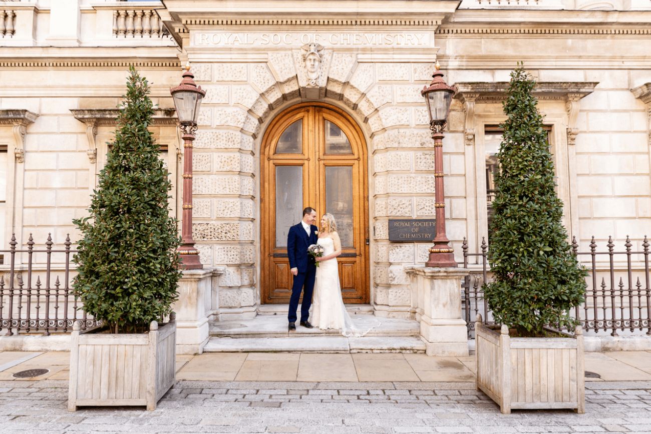 Newly married couple standing outside Burlington House Newly married couple standing outside Burlington House