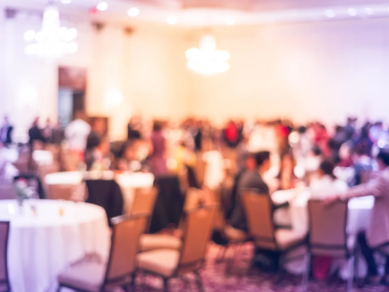 Blurred image of a networking and conference setting