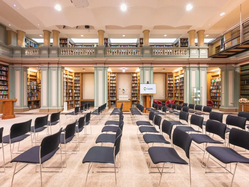 Bookshelves and rows of chairs in library RSC Burlington House