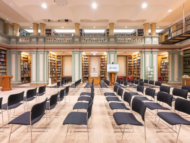 Bookshelves and rows of chairs in library RSC Burlington House
