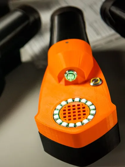 a close up of an orange device created by Harm reduction prize winners