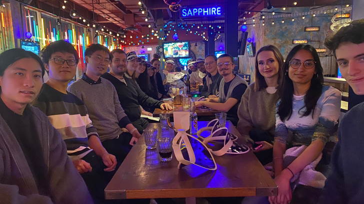 Professor Kim Jelfs with group of people sitting around a table