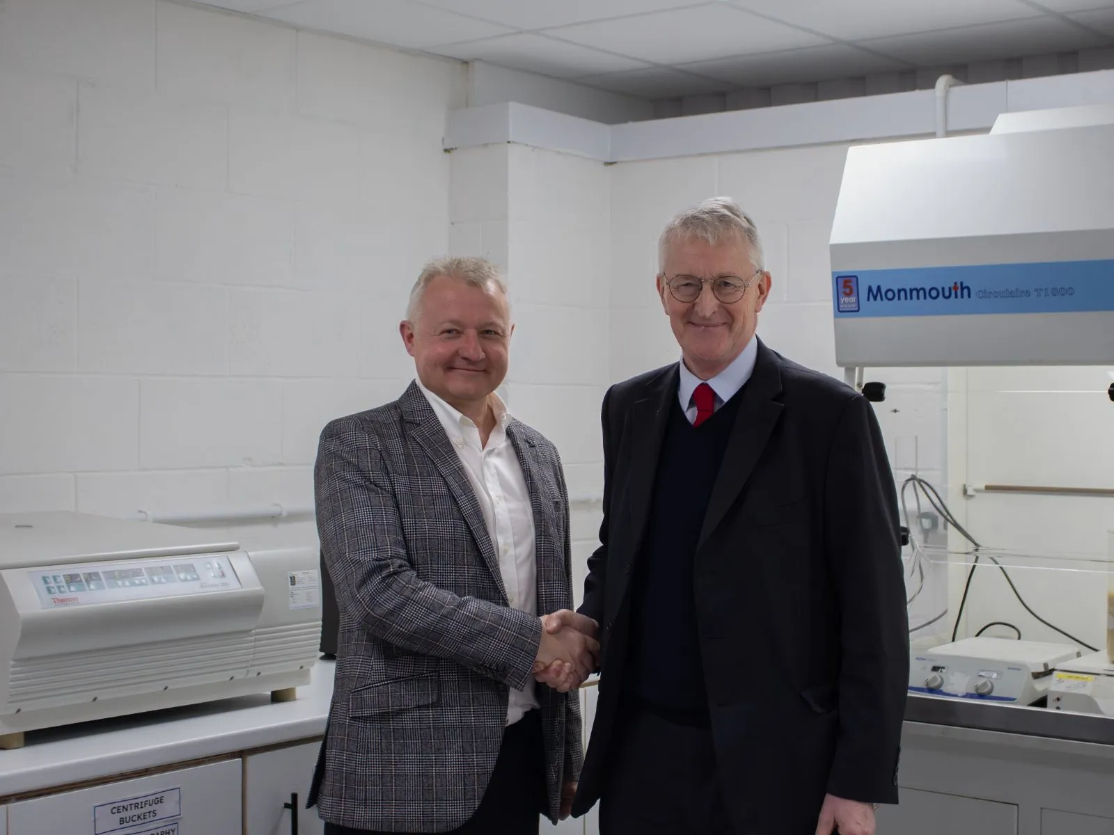 Andrew Waterworth, Manager of Impact Investment Initiatives, shakes hands with Hilary Benn MP