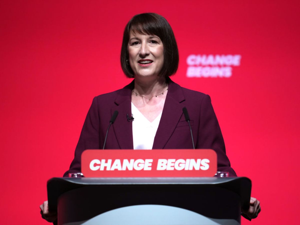Rachel Reeves uk chancellor of the exchequer outside at podium delivering speech