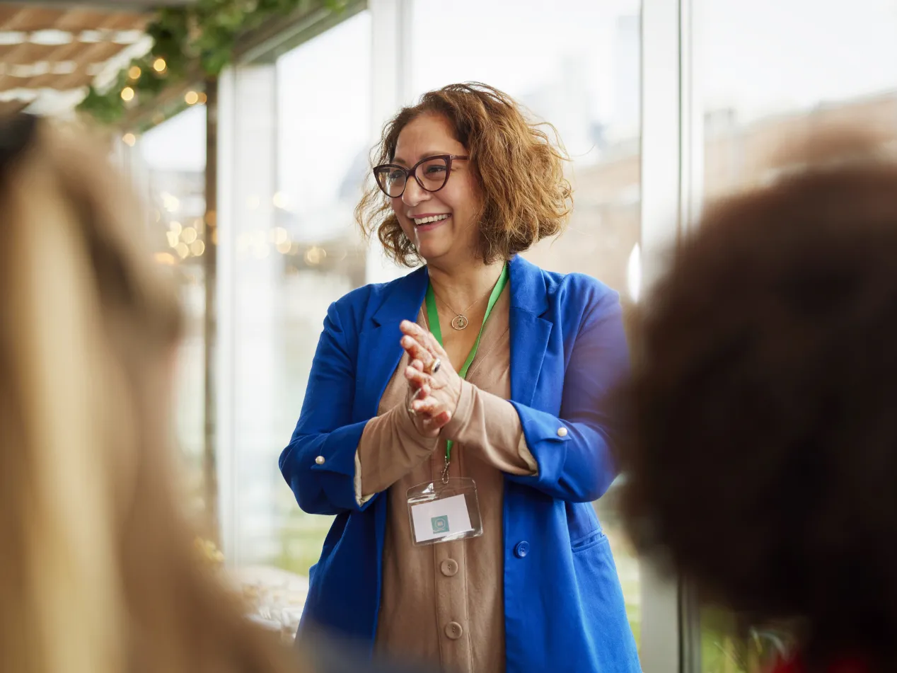 a woman presenting with her hands together