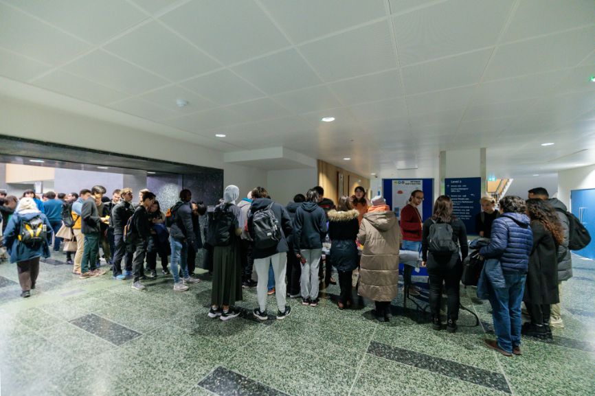 A crowd surveys the Bitesized Soft Matter stall at the Imperial Lates event