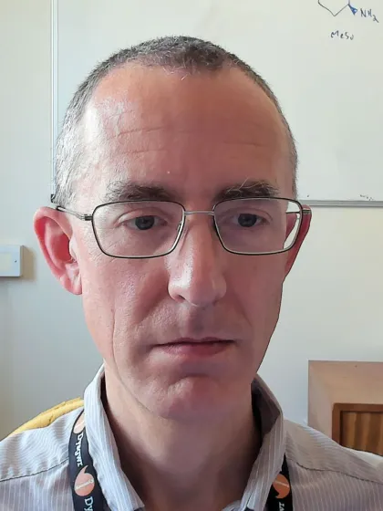 Dr James Redman wearing glasses