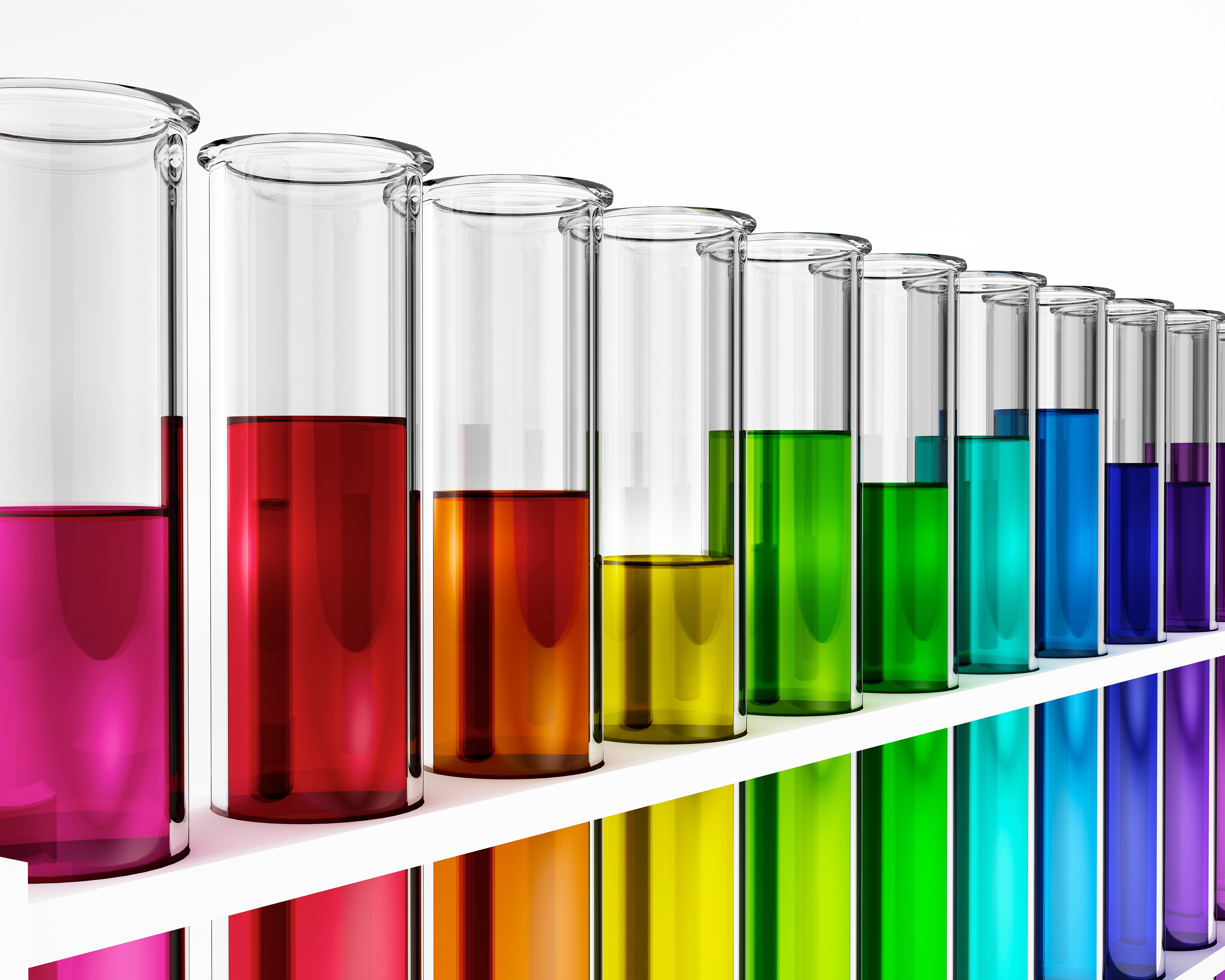 A series of test tubes filled from left to right with rainbow-coloured liquids A series of test tubes filled from left to right with rainbow-coloured liquids