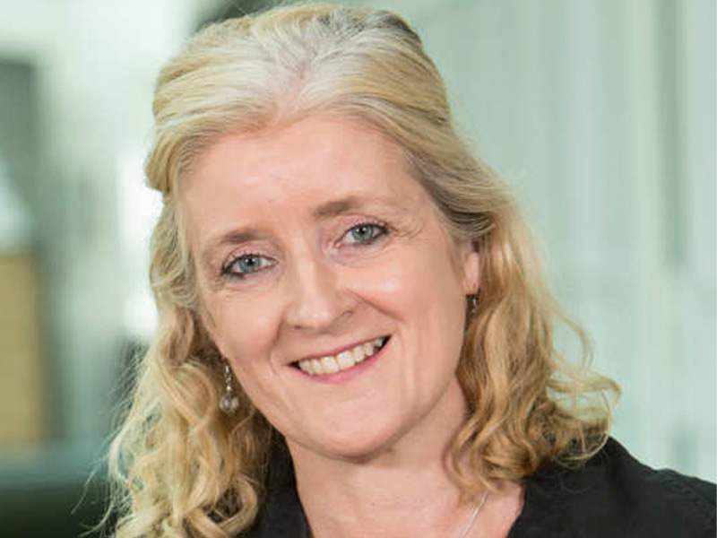 A head-and-shoulders photo of a smiling Dr Annette Doherty