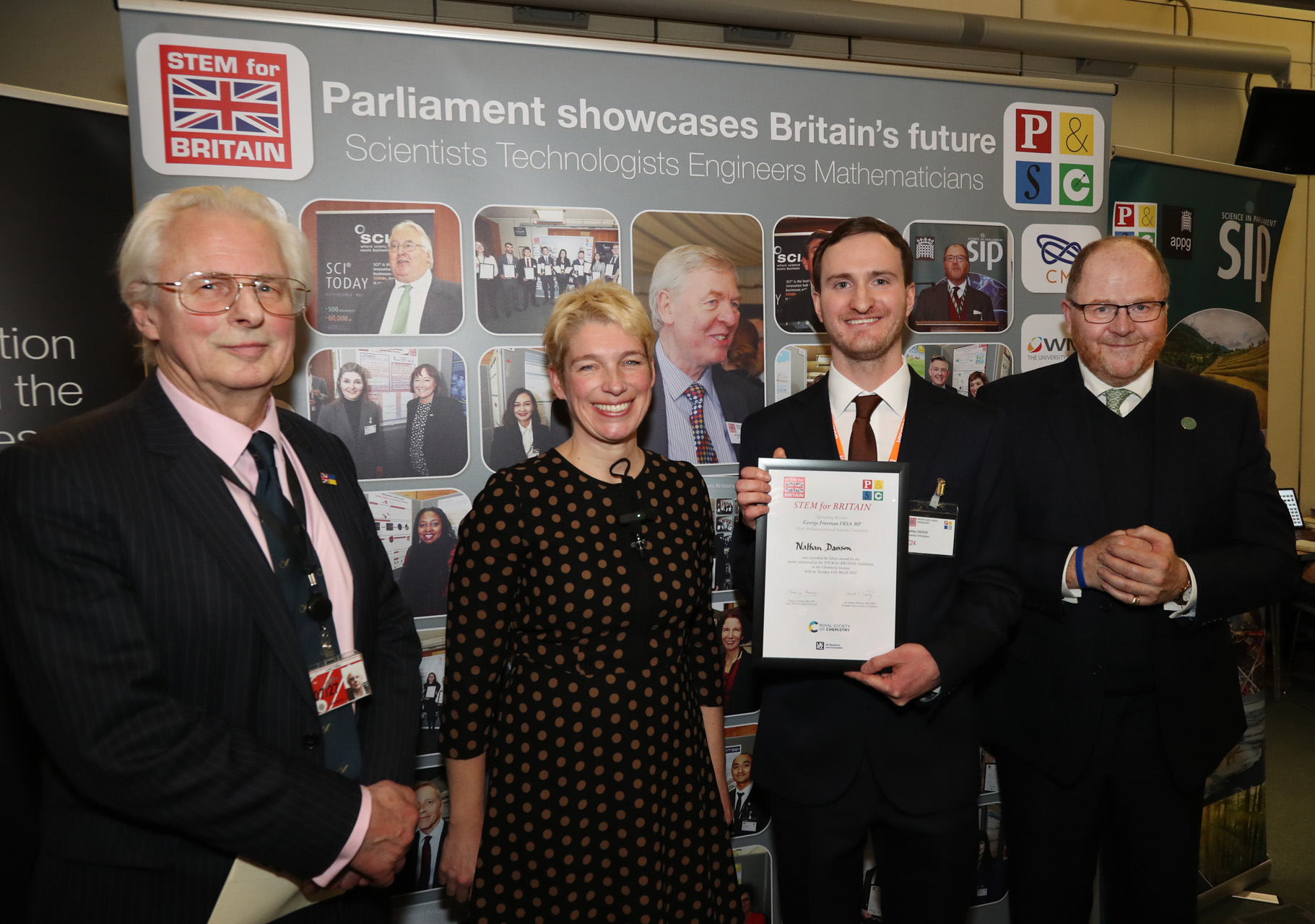EPSRC NRF for EPR team members standing with certificate and RSC staff members